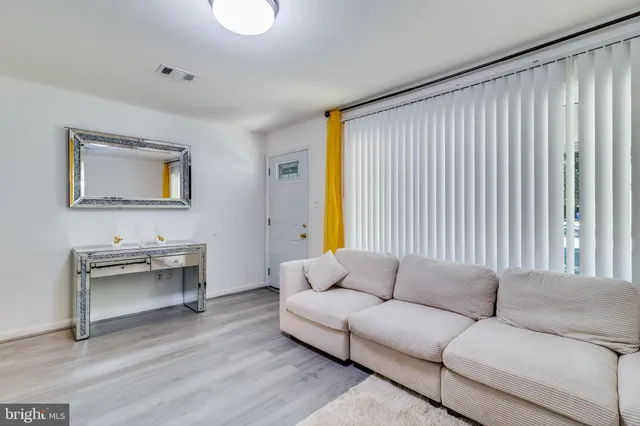 a kitchen with stainless steel appliances a stove microwave and refrigerator