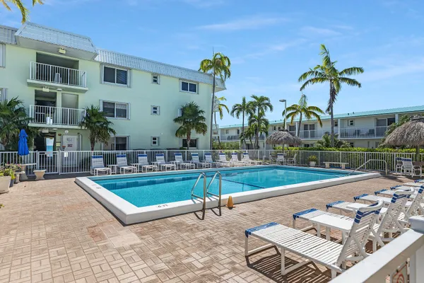 a view of swimming pool with outdoor seating