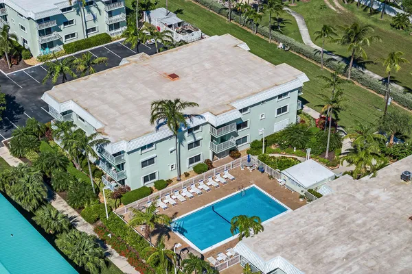 a view of a swimming pool with a lounge chair