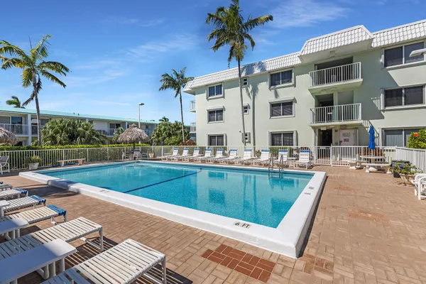 a view of swimming pool with outdoor seating