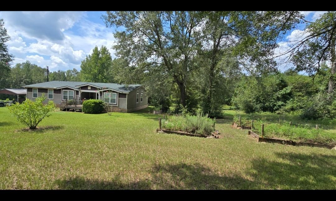 427 County Road 4822 Timpson, TX 75975 - Photo 2 of 23 a view of house with backyard