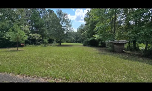 a view of a backyard with a garden
