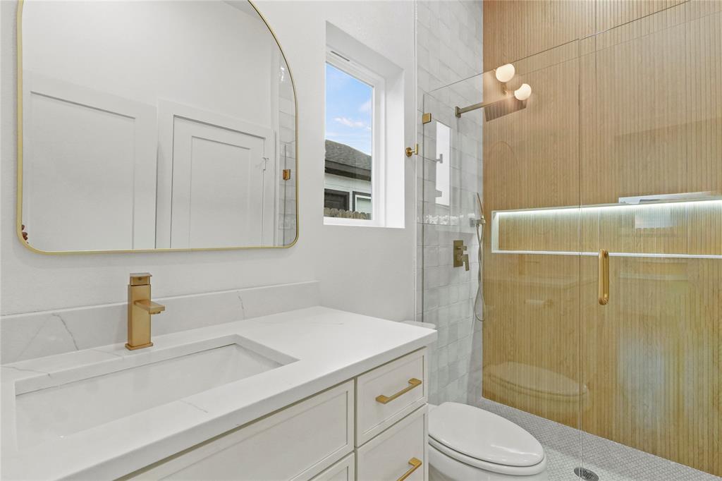 3910 Hancock Street Dallas, TX 75210 - Photo 12 of 20 a bathroom with a sink a toilet and shower