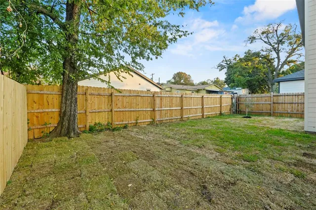 a view of outdoor space with deck and a big yard