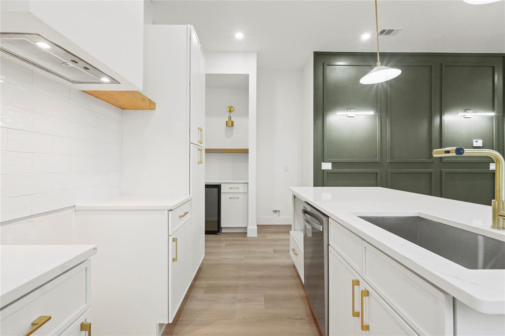 3910 Hancock Street Dallas, TX 75210 - Photo 8 of 20 a kitchen with a sink and a refrigerator