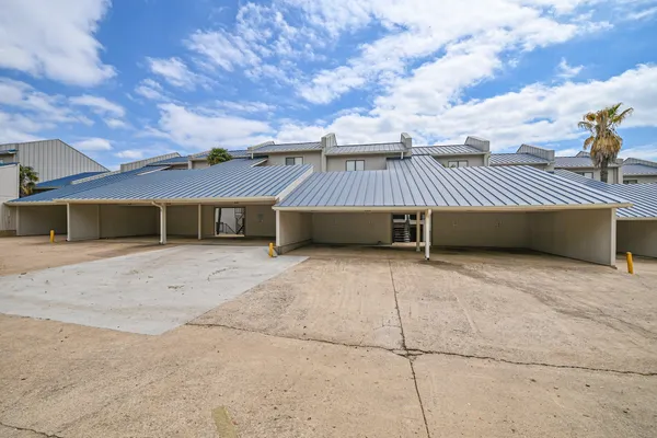 a view of a house with a yard and garage