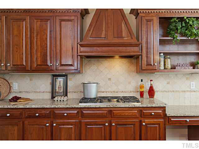 Gourmet kitchen equipped with STAINLESS STEEL appliances, GRANITE counter tops, and CHERRY cabinets. Kitchen