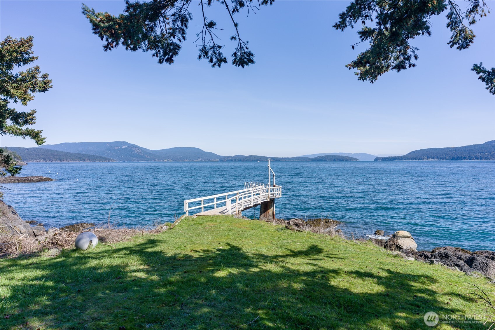 208 Tides End Road Lopez Island, WA 98261 - Photo 1 of 40 a view of a terrace with a garden