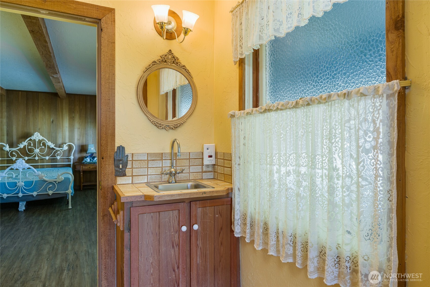 208 Tides End Road Lopez Island, WA 98261 - Photo 17 of 40 a bathroom with a granite countertop sink and a mirror