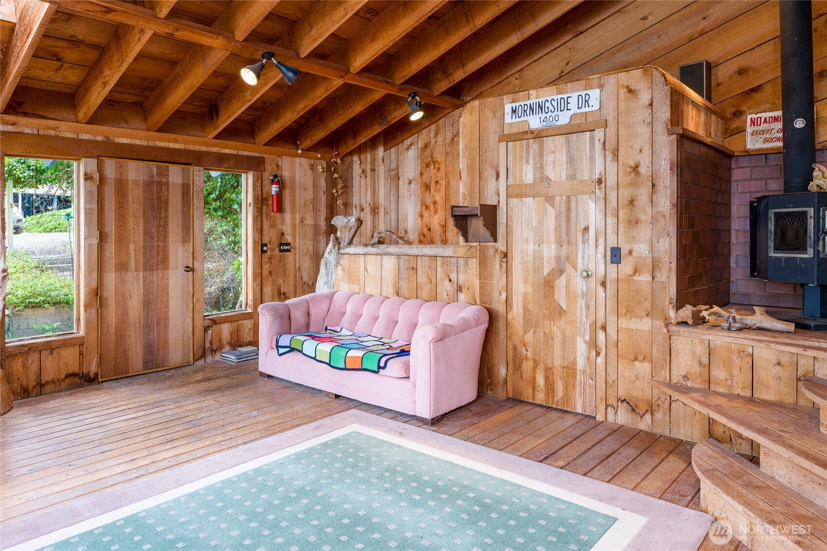 208 Tides End Road Lopez Island, WA 98261 - Photo 30 of 40 a living room with furniture and a fireplace