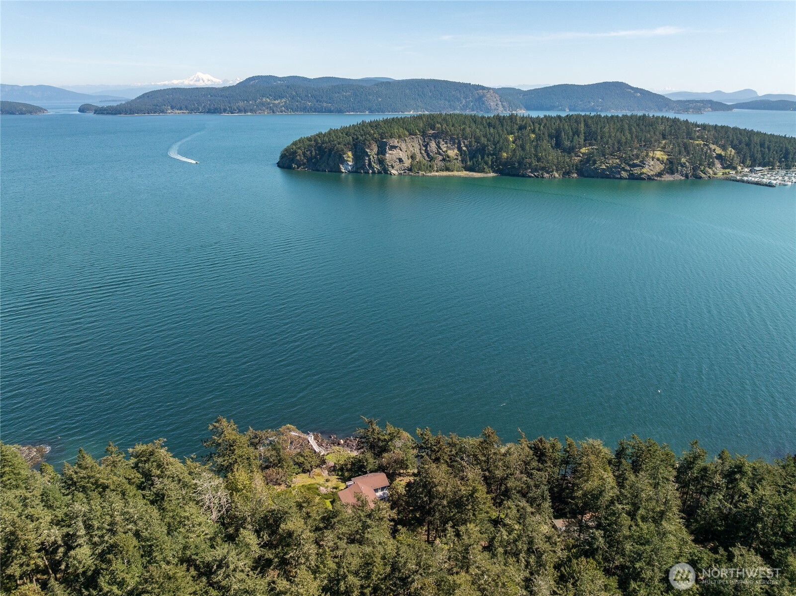 208 Tides End Road Lopez Island, WA 98261 - Photo 3 of 40 a view of a lake with a mountain