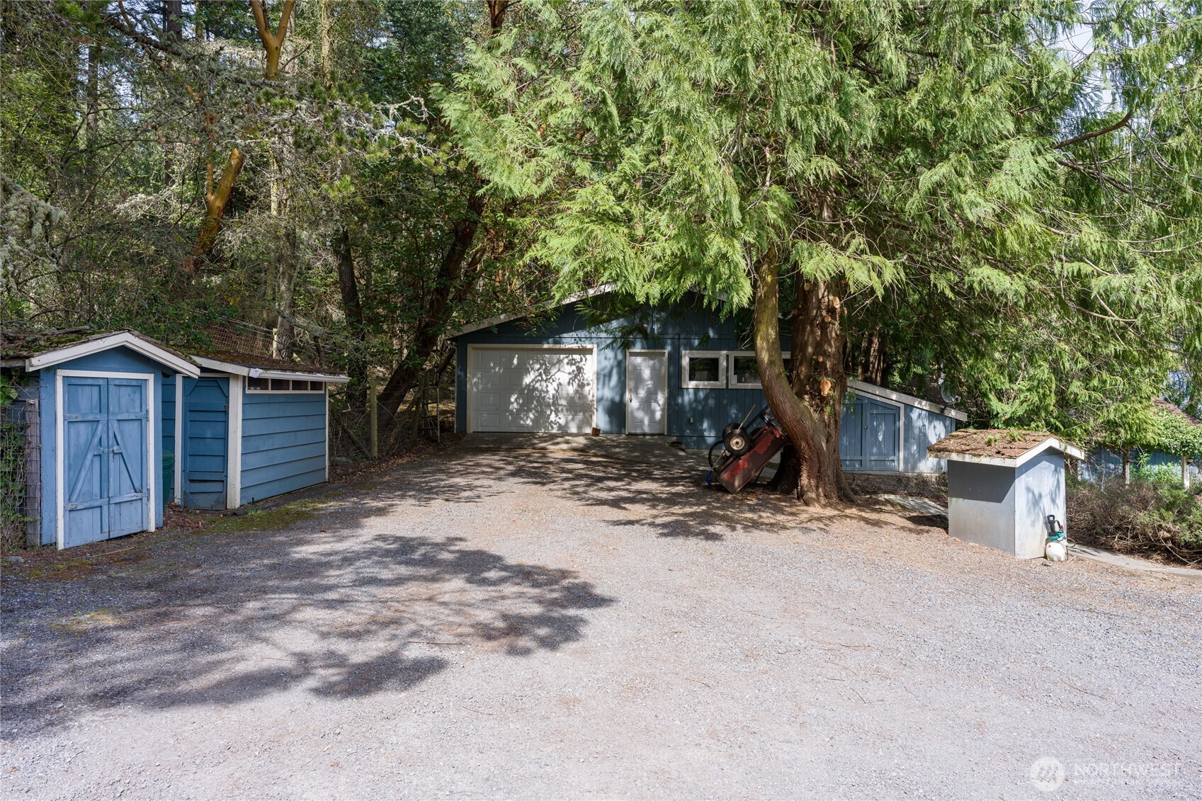 208 Tides End Road Lopez Island, WA 98261 - Photo 33 of 40 a view of a house with backyard and trees