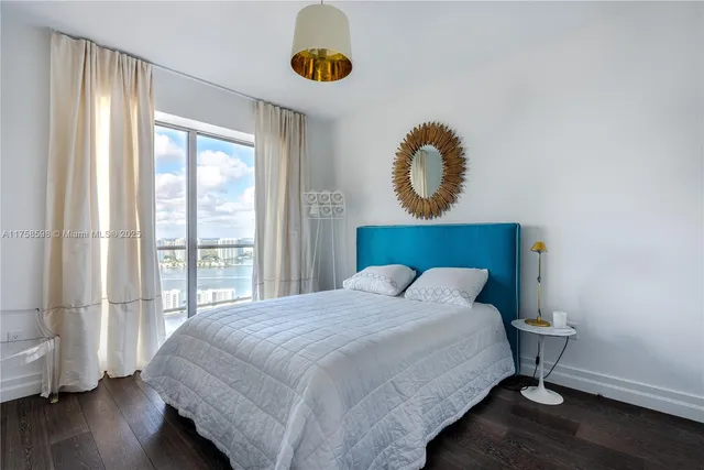 a front view of a house with a garden and parking space