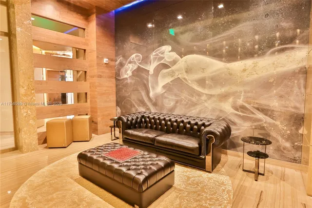 a dining room with furniture and a kitchen view