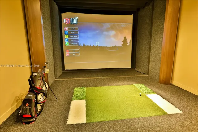 a living room with furniture a flat screen tv and kitchen view
