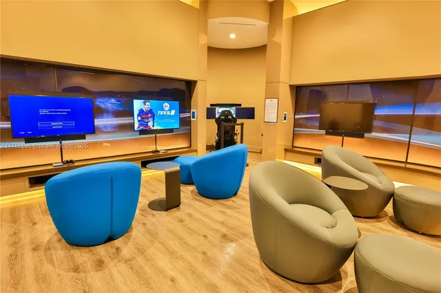 a view of a lobby with furniture and floor to ceiling windows