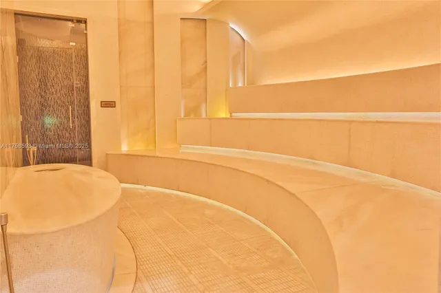 a view of a table and chairs under an umbrella