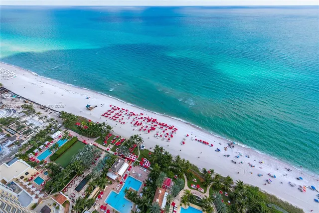 a living room with fireplace furniture and a flat screen tv