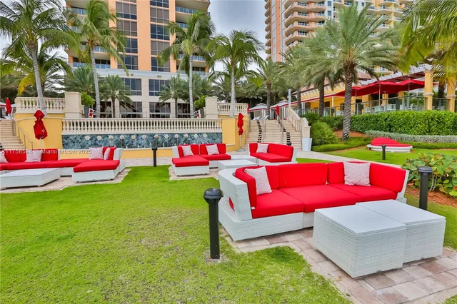 a front view of building with yard and play ground