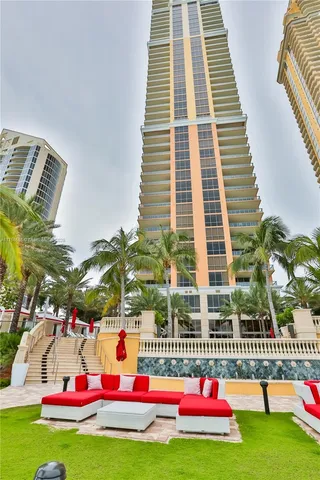 a kitchen with stainless steel appliances kitchen island granite countertop a sink and cabinets