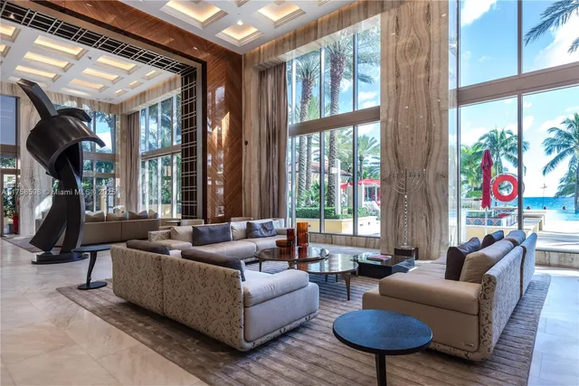 a view of a swimming pool with an outdoor space and seating area