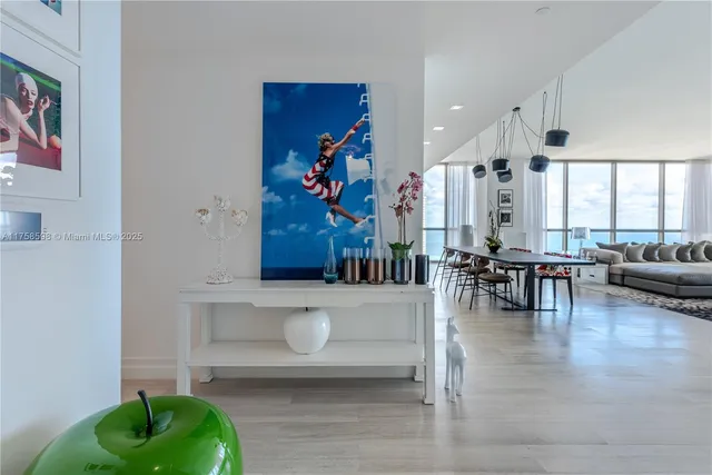 a bedroom with a large bed and a large window