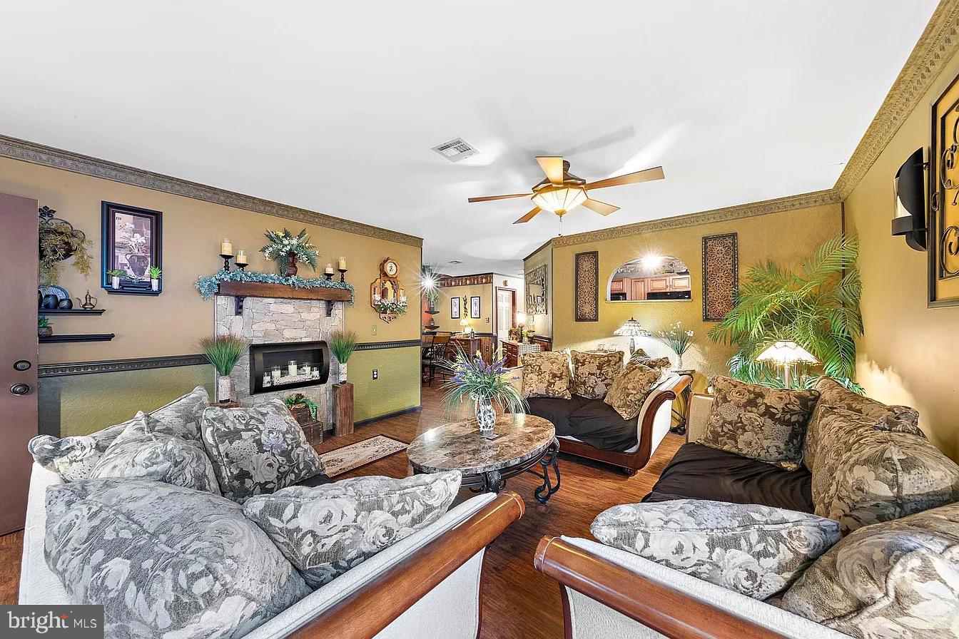 22 Fir Road Manahawkin, NJ 08050 - Photo 6 of 35 a living room with furniture and a fireplace