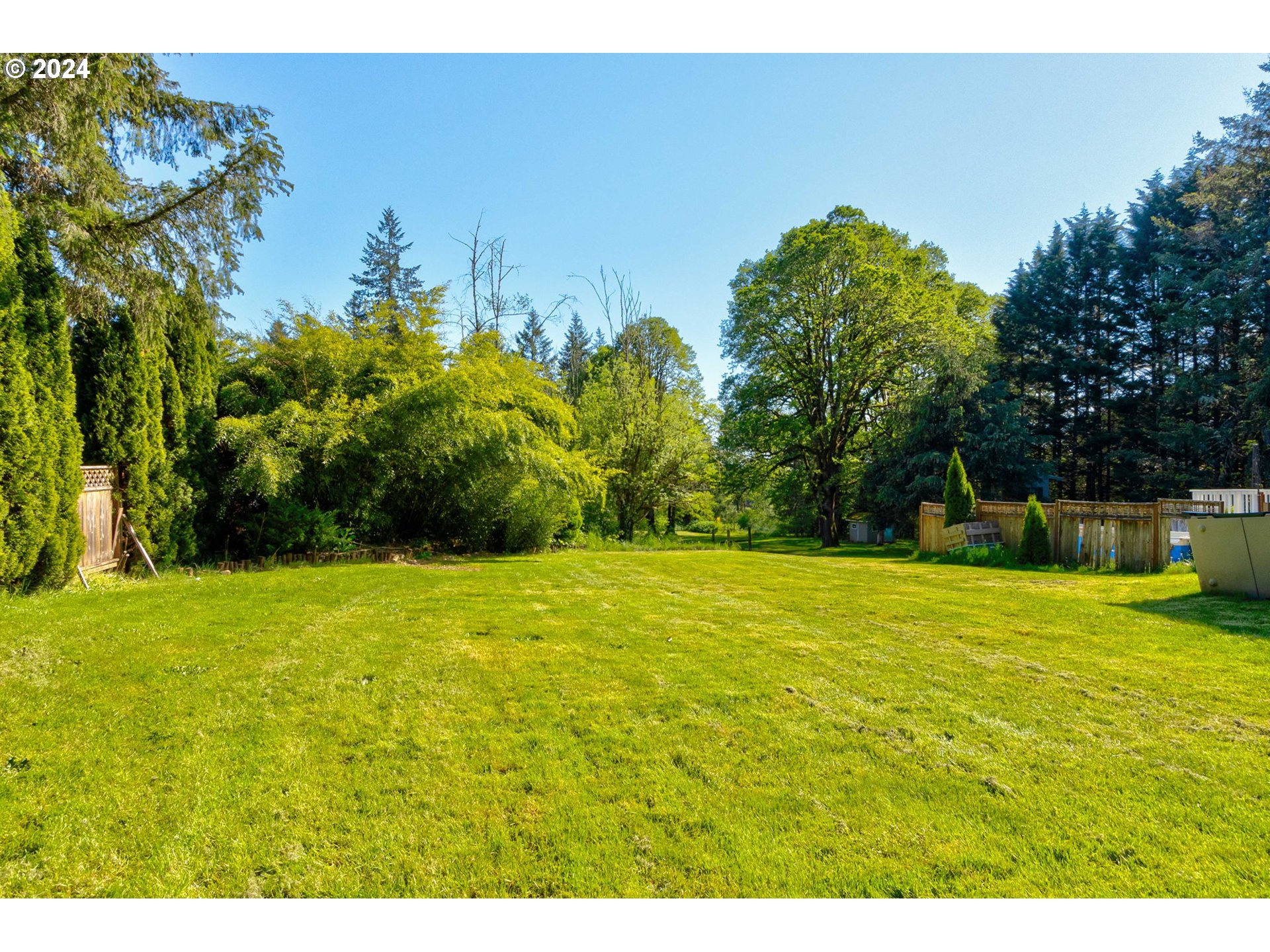 30121 Northeast Harrison Road Battle Ground, WA 98604 - Photo 28 of 40 a view of a yard with an trees
