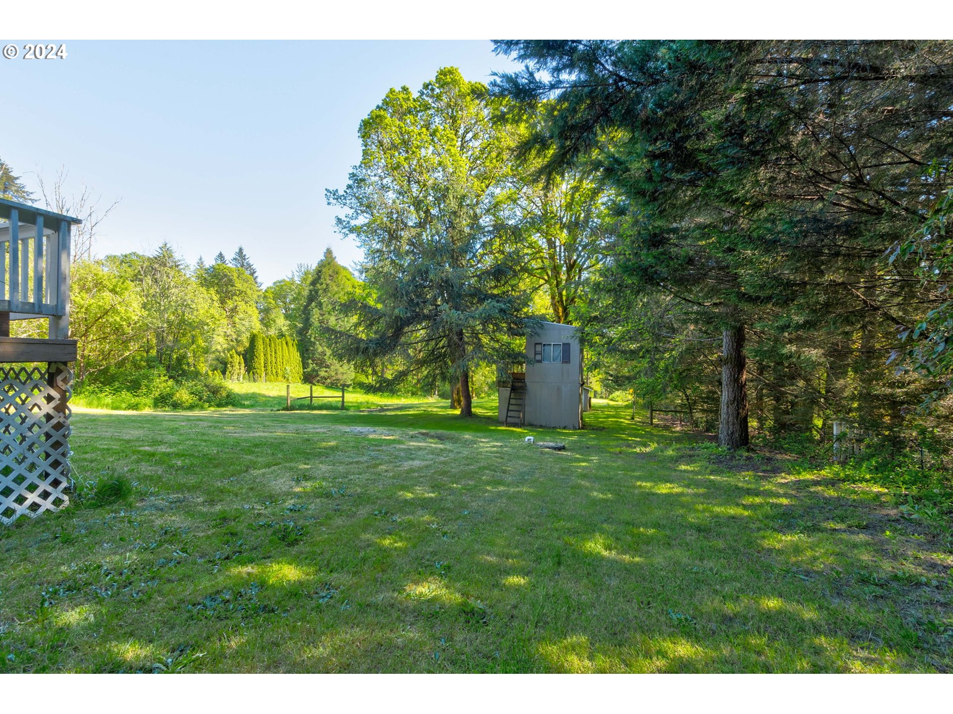 30121 Northeast Harrison Road Battle Ground, WA 98604 - Photo 29 of 40 a backyard of a house with lots of green space