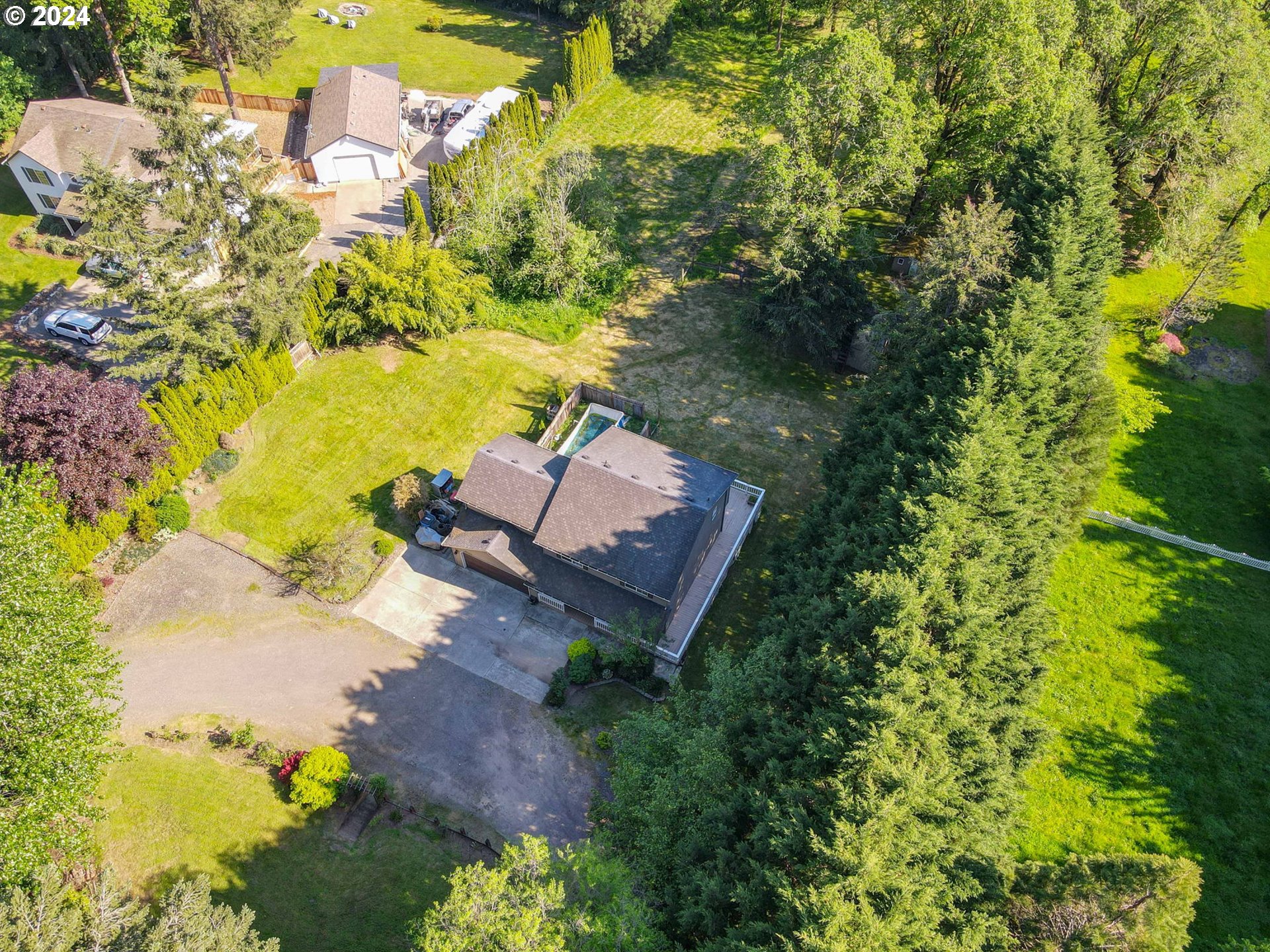 30121 Northeast Harrison Road Battle Ground, WA 98604 - Photo 36 of 40 an aerial view of a house with a yard swimming pool outdoor seating and yard