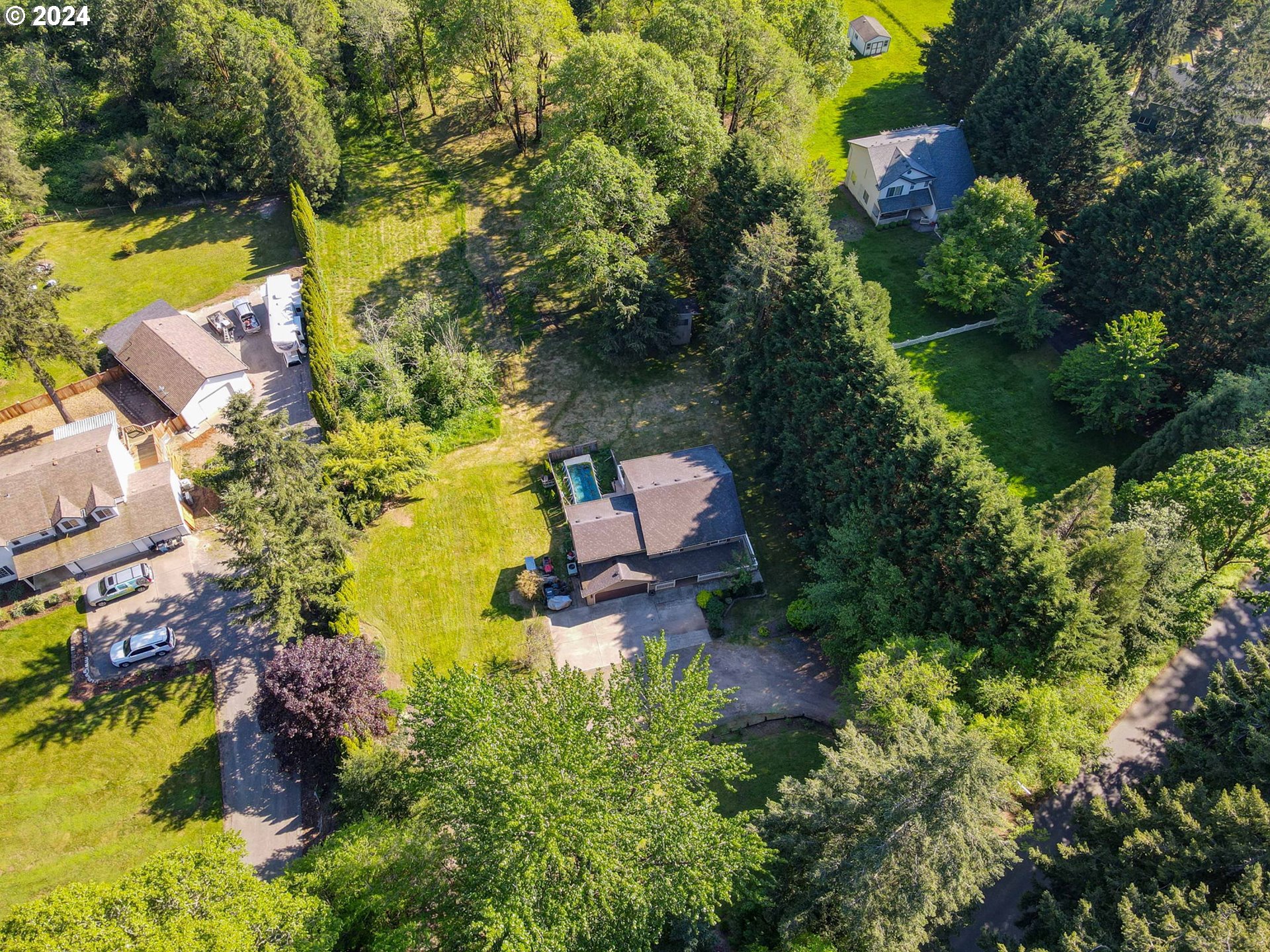 30121 Northeast Harrison Road Battle Ground, WA 98604 - Photo 38 of 40 an aerial view of residential house with outdoor space and swimming pool