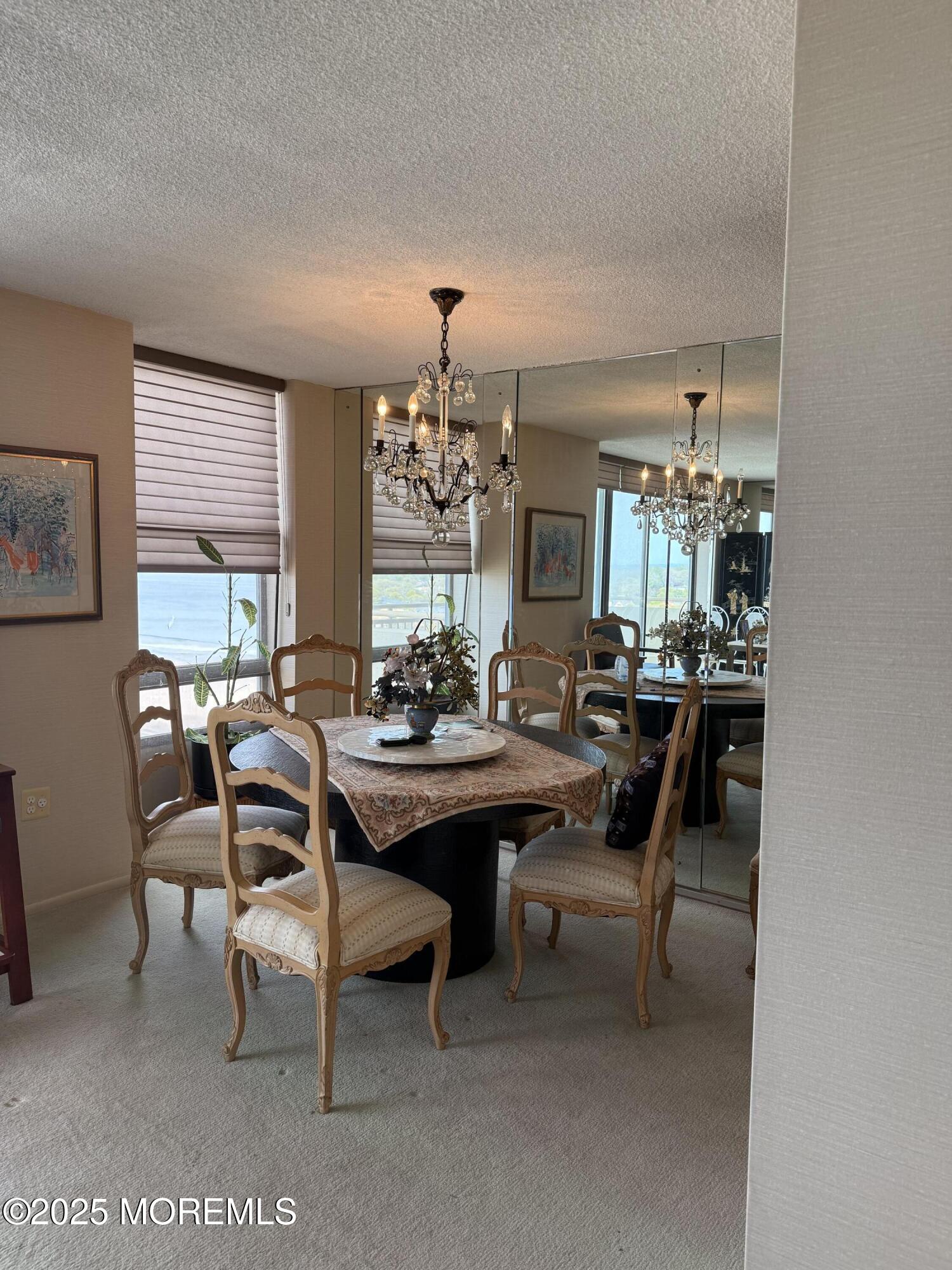 787 Ocean Avenue, Unit 1414 Long Branch, NJ 07740 - Photo 3 of 10 a view of a dining room with furniture