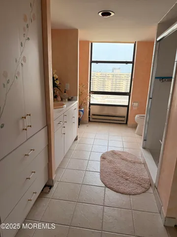 a bathroom with a sink a mirror and shower