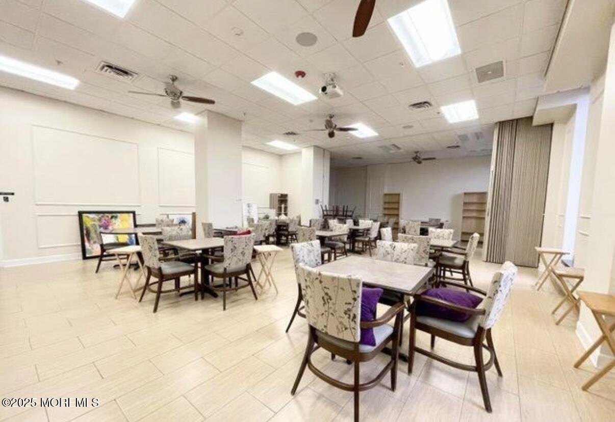 787 Ocean Avenue, Unit 1414 Long Branch, NJ 07740 - Photo 8 of 10 a view of a dining area with furniture