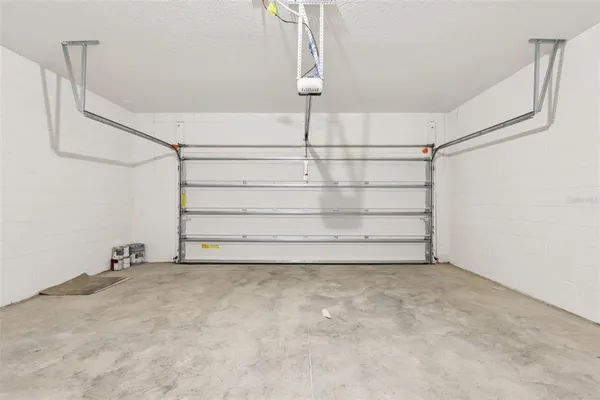 a view of a white house with a yard