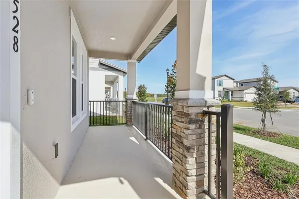 a view of a hallway with windows and stairs