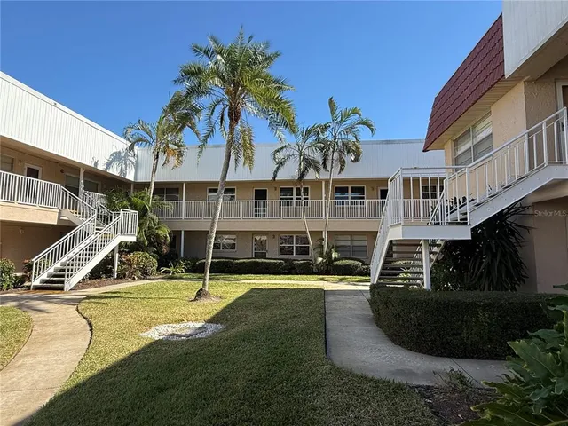 a view of a house with swimming pool and porch