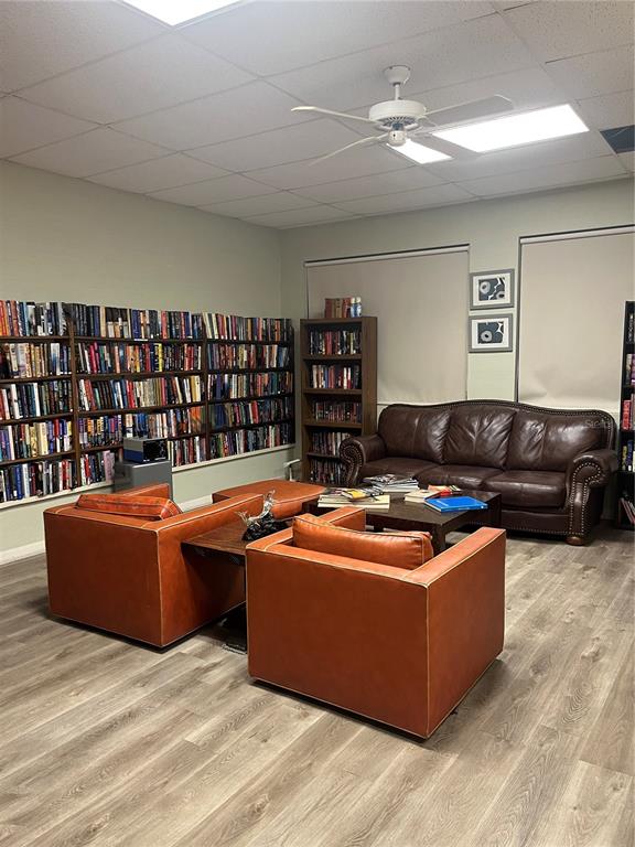 10038 62nd Avenue North, Unit 23 St. Petersburg, FL 33708 - Photo 22 of 25 a living room with couches and kitchen view