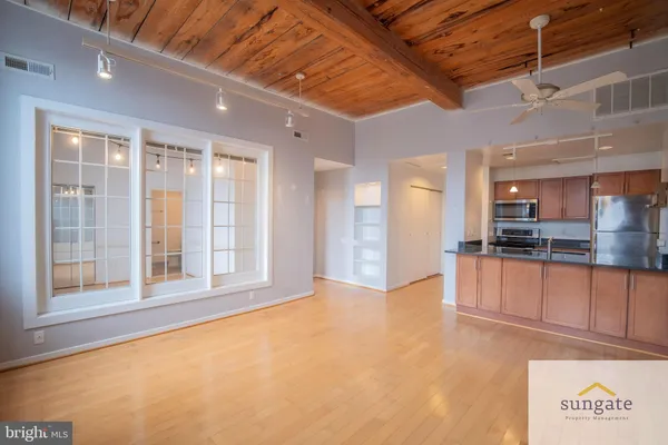 a view of an empty room with a window