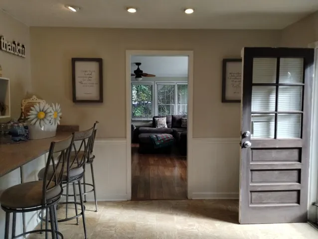 a view of a livingroom with furniture and windows