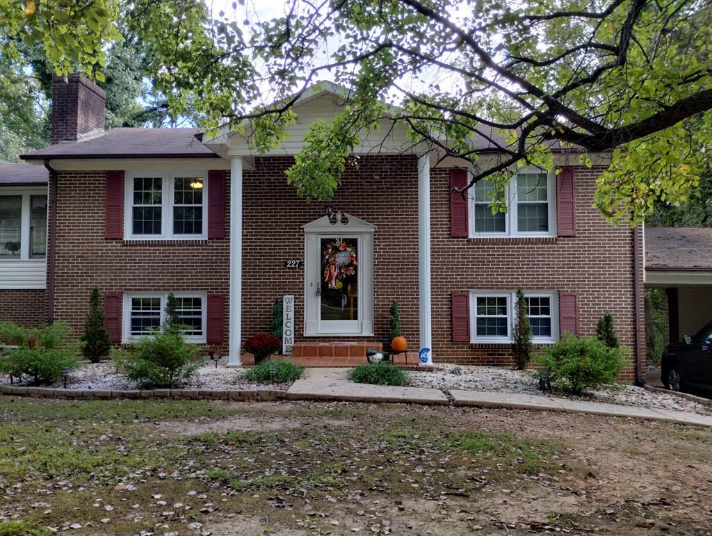 227 Vista View Lane Ridgeway, VA 24148 - Photo 2 of 45 a front view of a house with a yard and garage