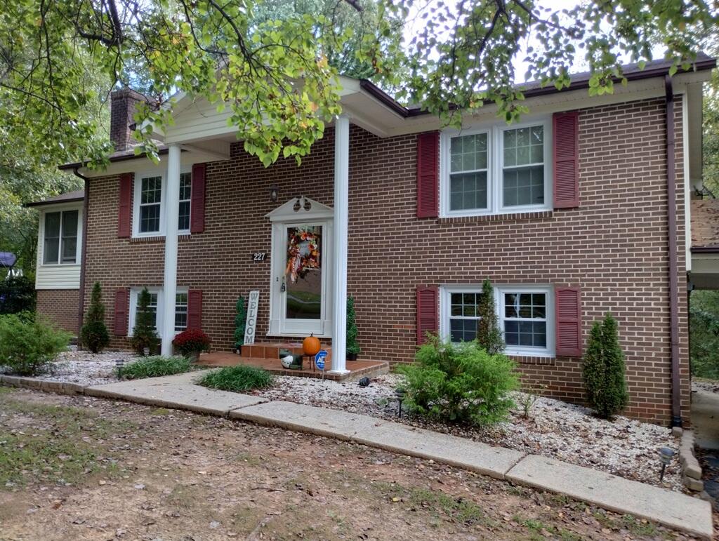 227 Vista View Lane Ridgeway, VA 24148 - Photo 3 of 45 a front view of a house with garden