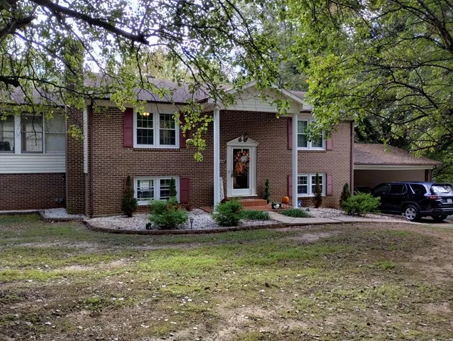 a view of a roof deck with wooden floor and fence