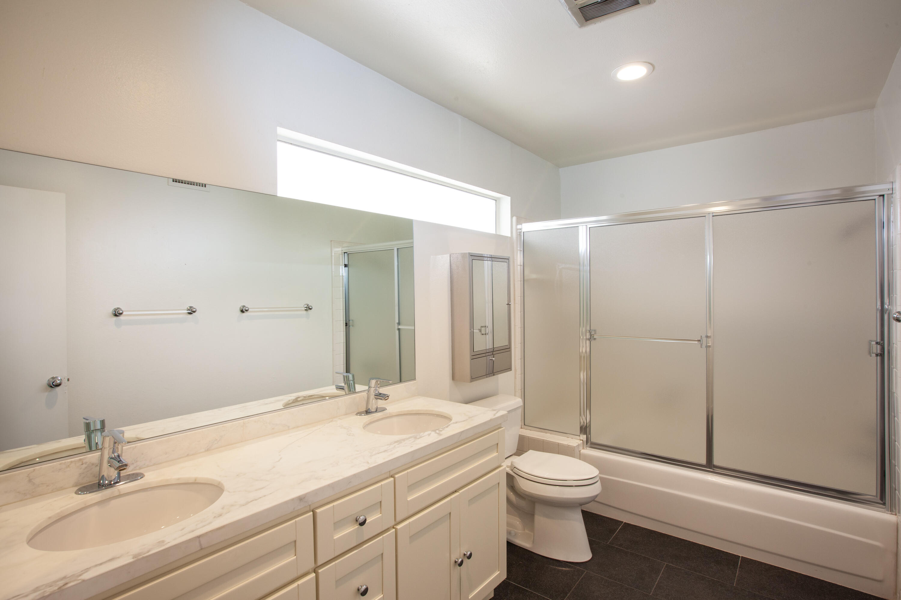 3033 East Verona Road Palm Springs, CA 92262 - Photo 13 of 23 a bathroom with a double vanity sink toilet and shower