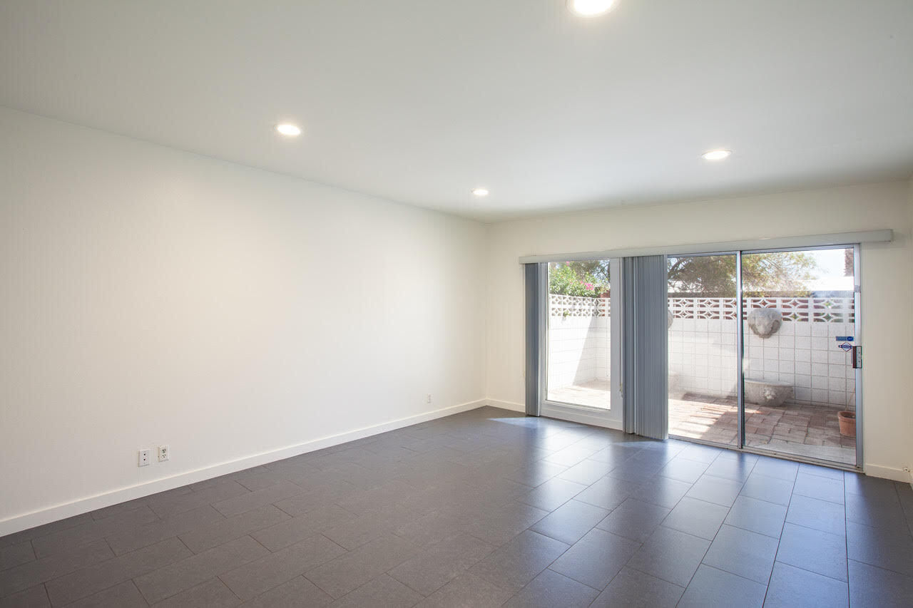 3033 East Verona Road Palm Springs, CA 92262 - Photo 16 of 23 an empty room with wooden floor and windows