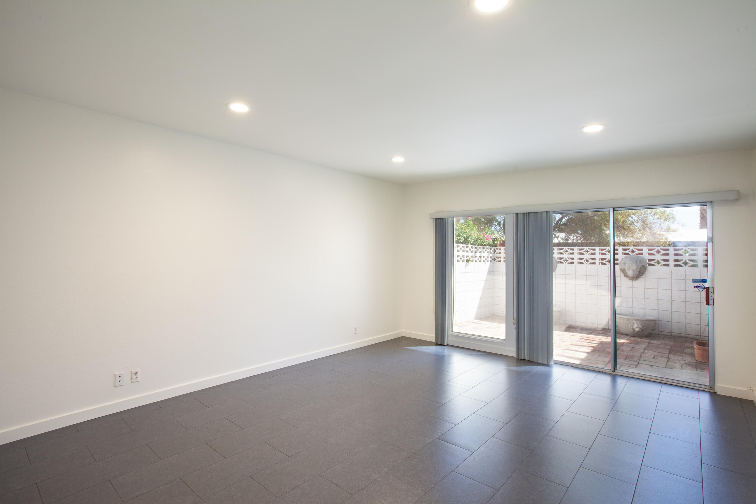 3033 East Verona Road Palm Springs, CA 92262 - Photo 16 of 23 an empty room with wooden floor and windows