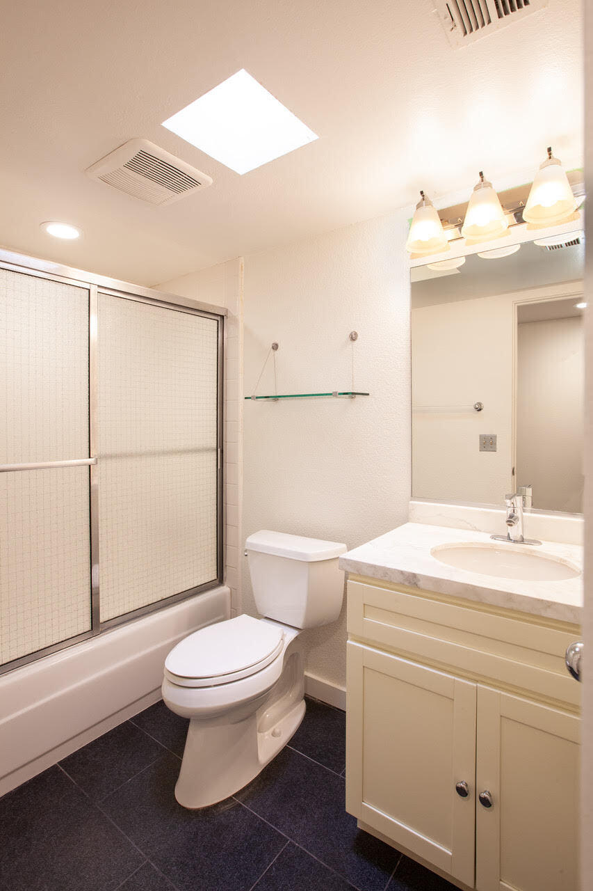 3033 East Verona Road Palm Springs, CA 92262 - Photo 21 of 23 a bathroom with a toilet a sink and a mirror
