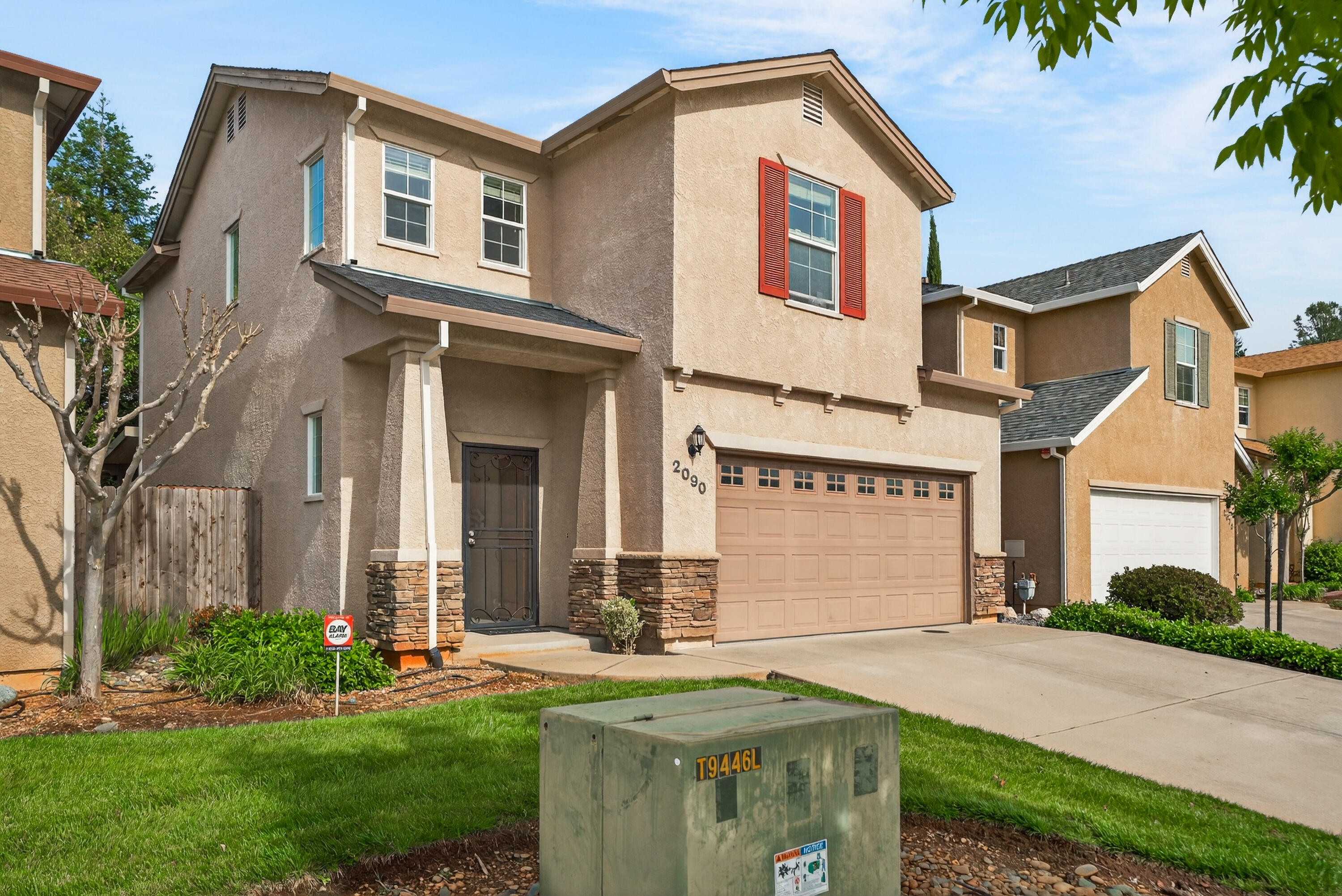 2090 Tuscany Way Redding, CA 96003 - Photo 1 of 37 a front view of a house with garden