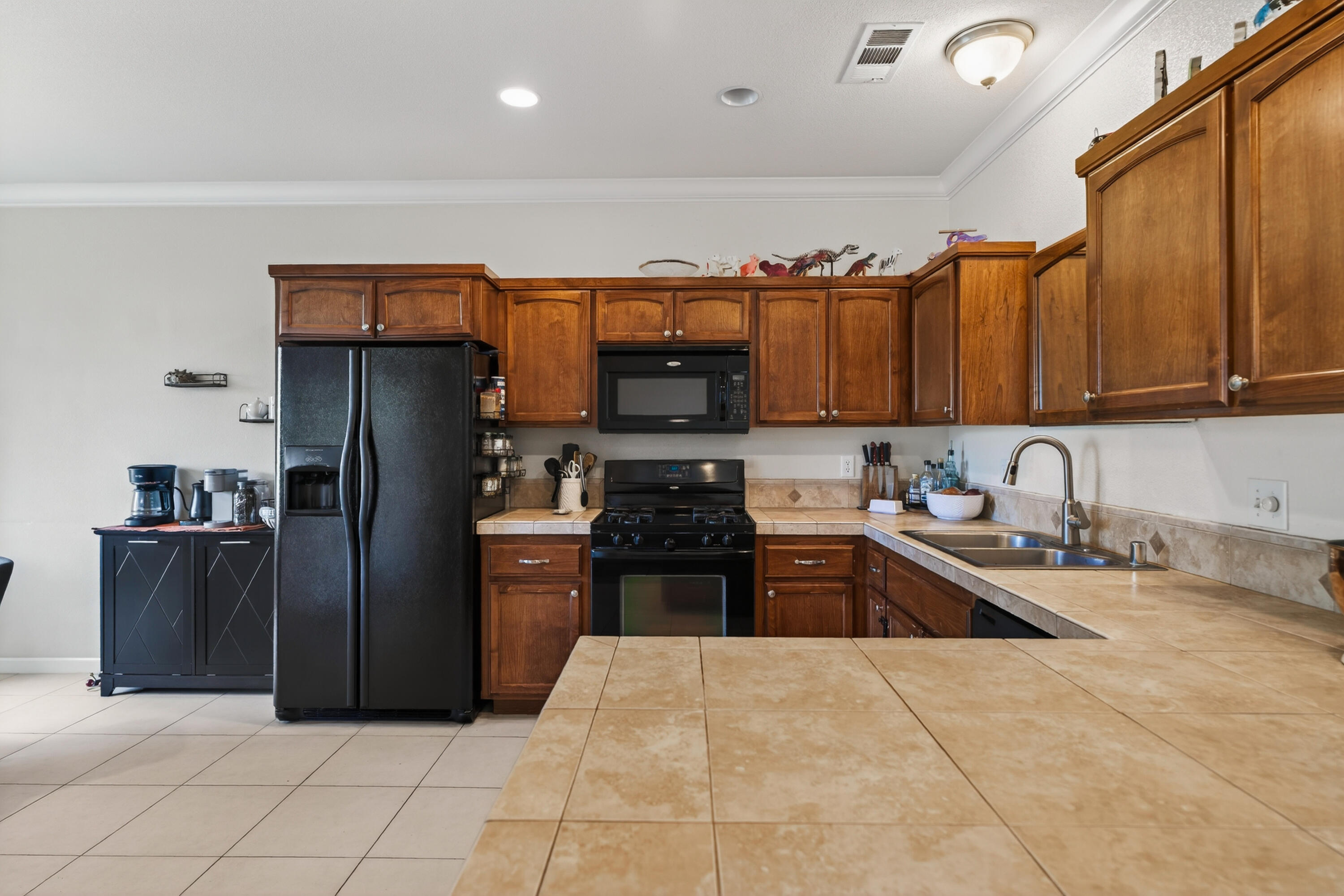 2090 Tuscany Way Redding, CA 96003 - Photo 12 of 37 a kitchen with stainless steel appliances granite countertop a refrigerator and a stove top oven