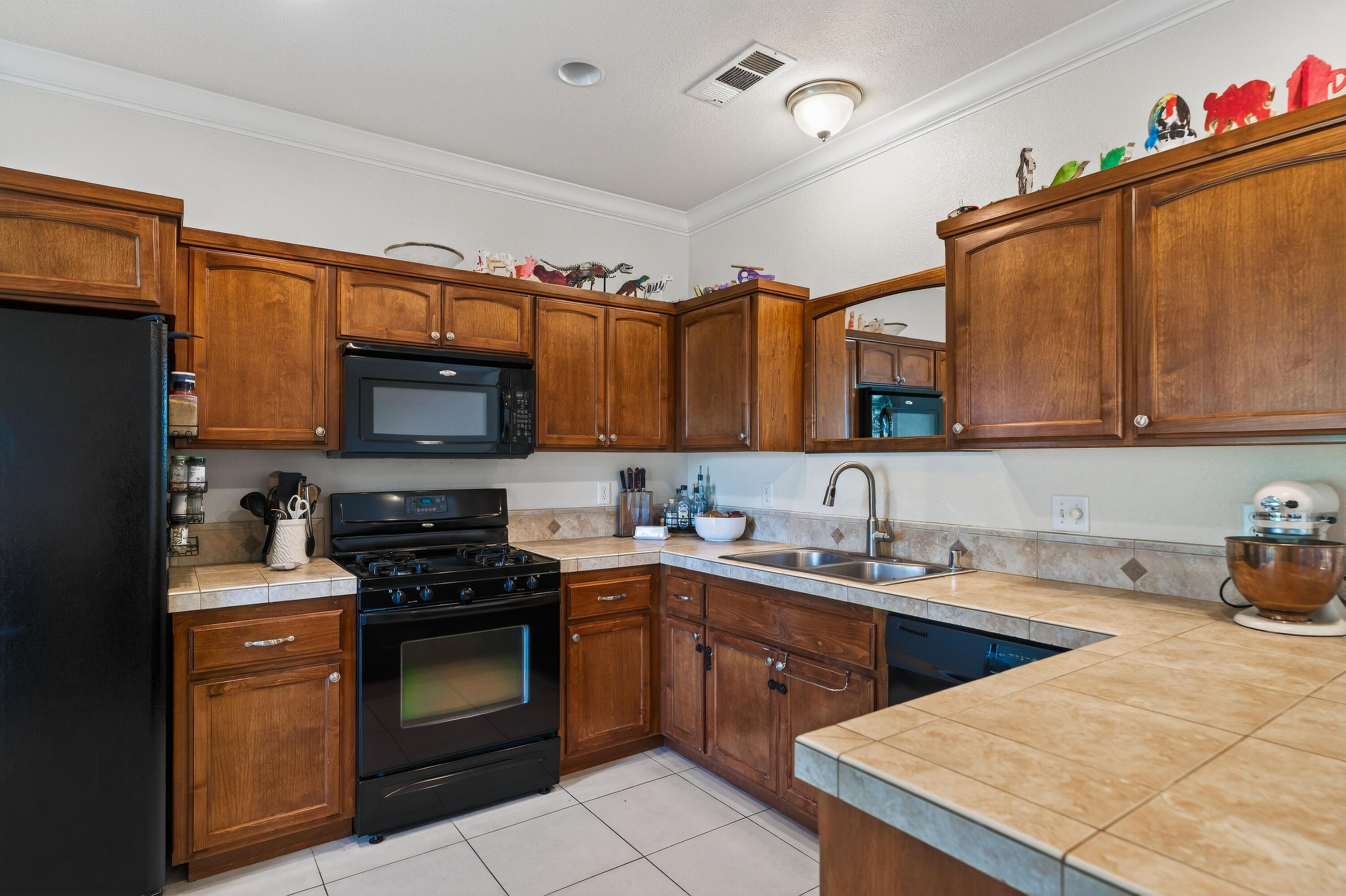 2090 Tuscany Way Redding, CA 96003 - Photo 13 of 37 a kitchen with a sink stove and microwave